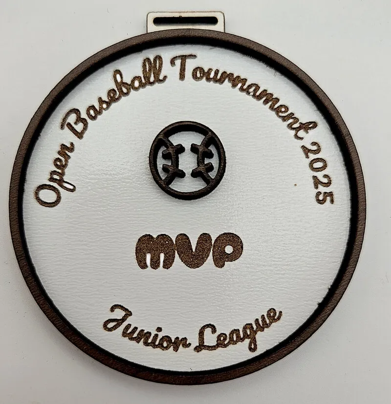 Medal made with walnut plywood showing elegant wood finish